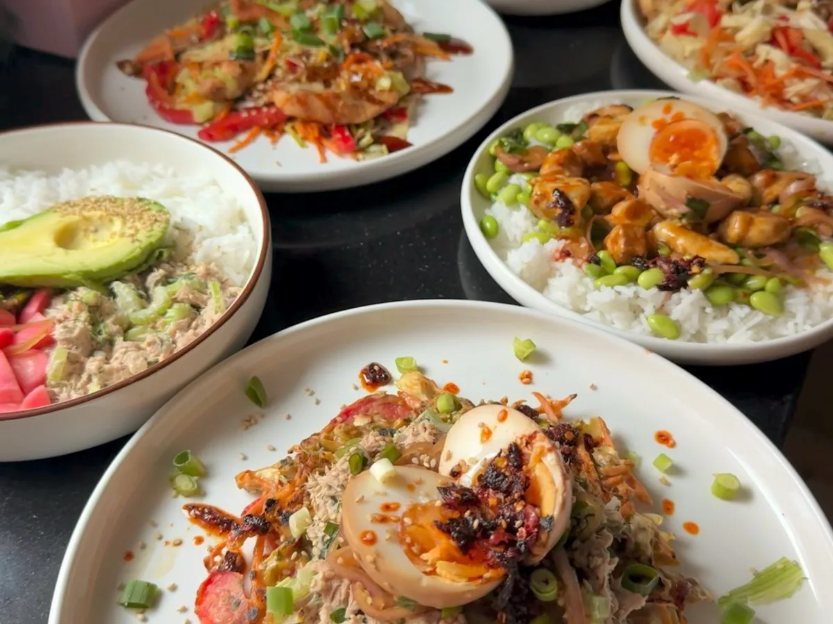 Five different meals assembled from one capsule meal prep — bowls, wraps, and plates with varied flavours